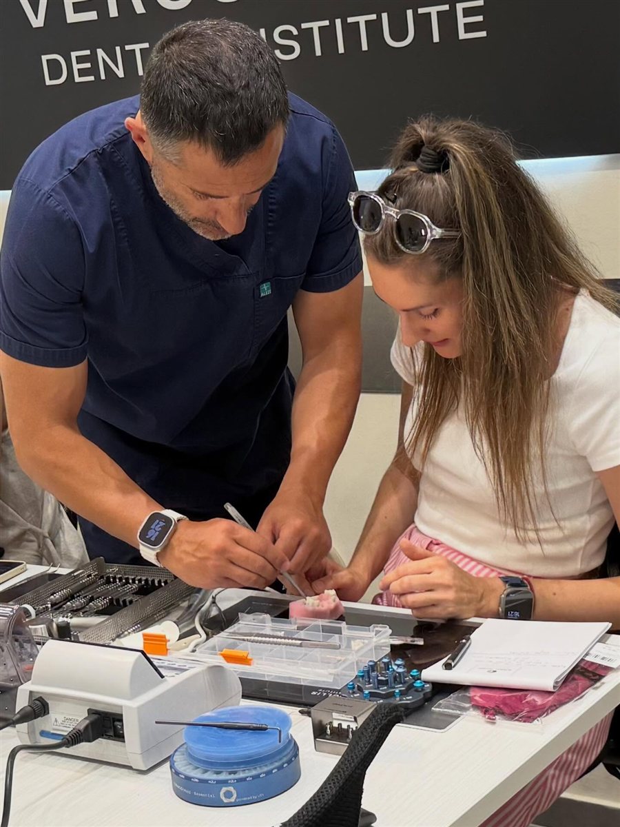 Dr. Vergoullis teaching a participant one on one